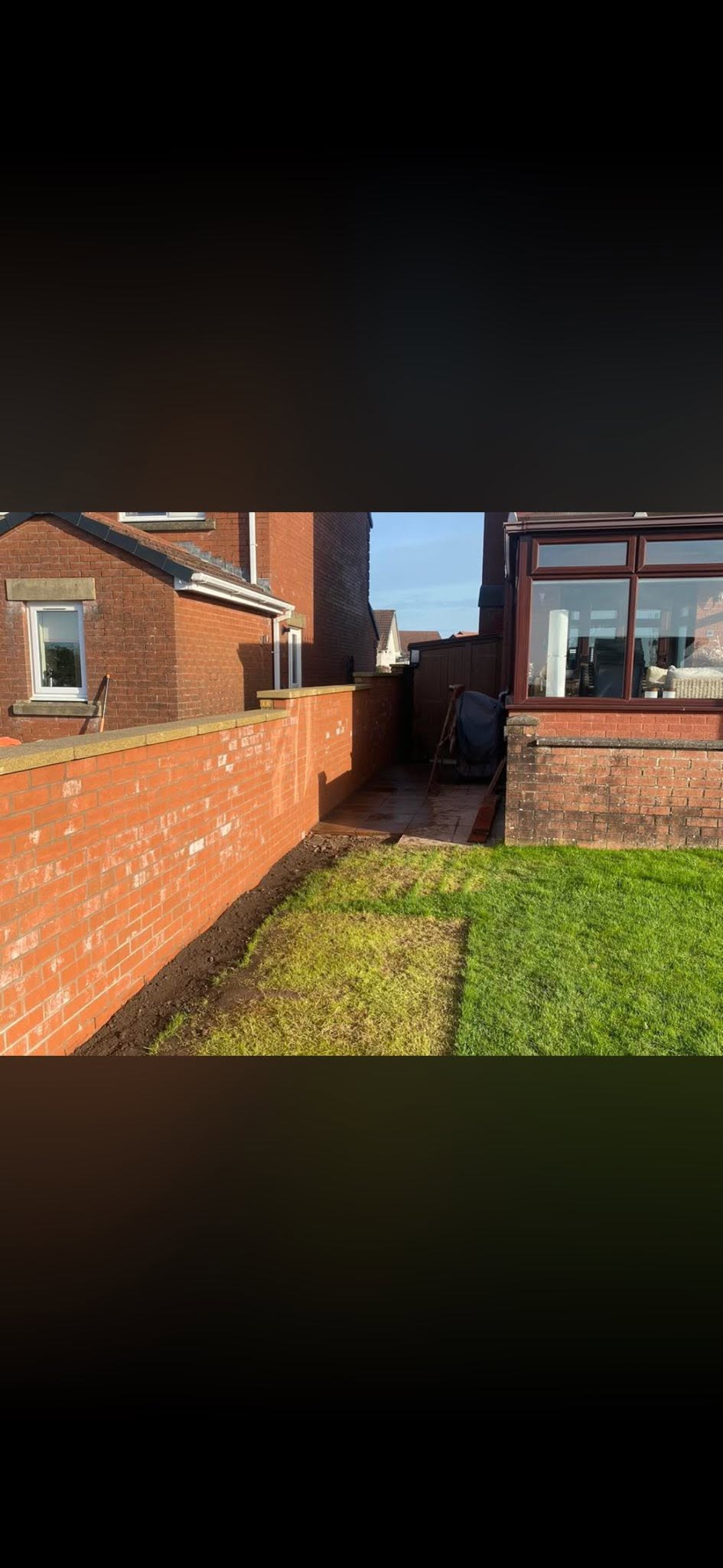 Matching red brick boundary wall in St Bees